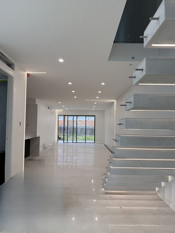 Recessed LED profile lighting and downlights, with lit floating stair treads, Birrong, NSW