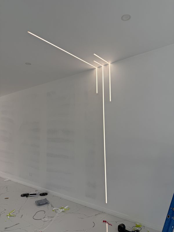 Recessed linear LED feature lines running from ceiling to wall, Birrong, NSW
