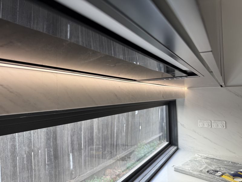 LED strip lighting under the kitchen rangehood and cabinetry, Birrong, NSW