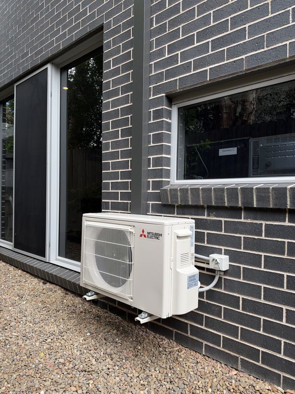 Mitsubishi Electric outdoor unit on wall brackets, with weatherproof isolator, Concord, NSW